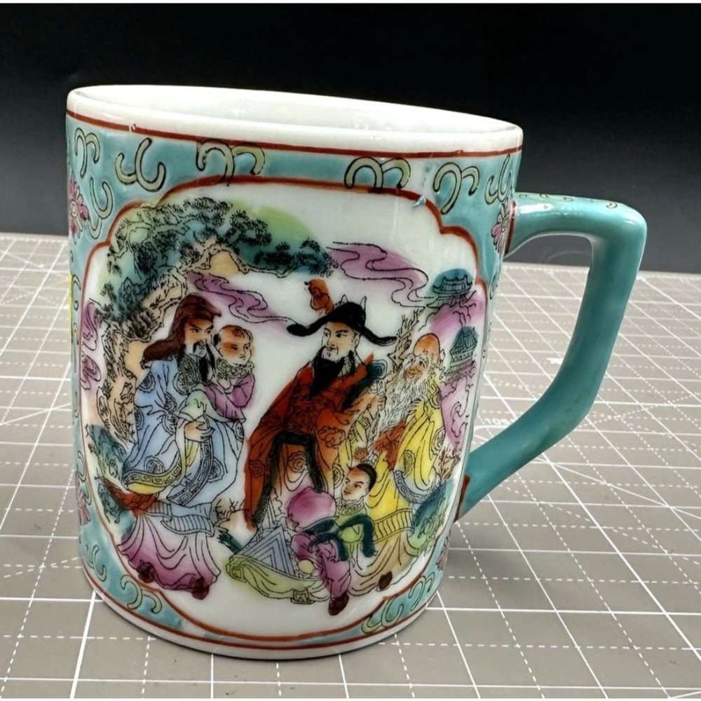 Vintage Hand Painted Porcelain Chinese Tea Cup Teal Background